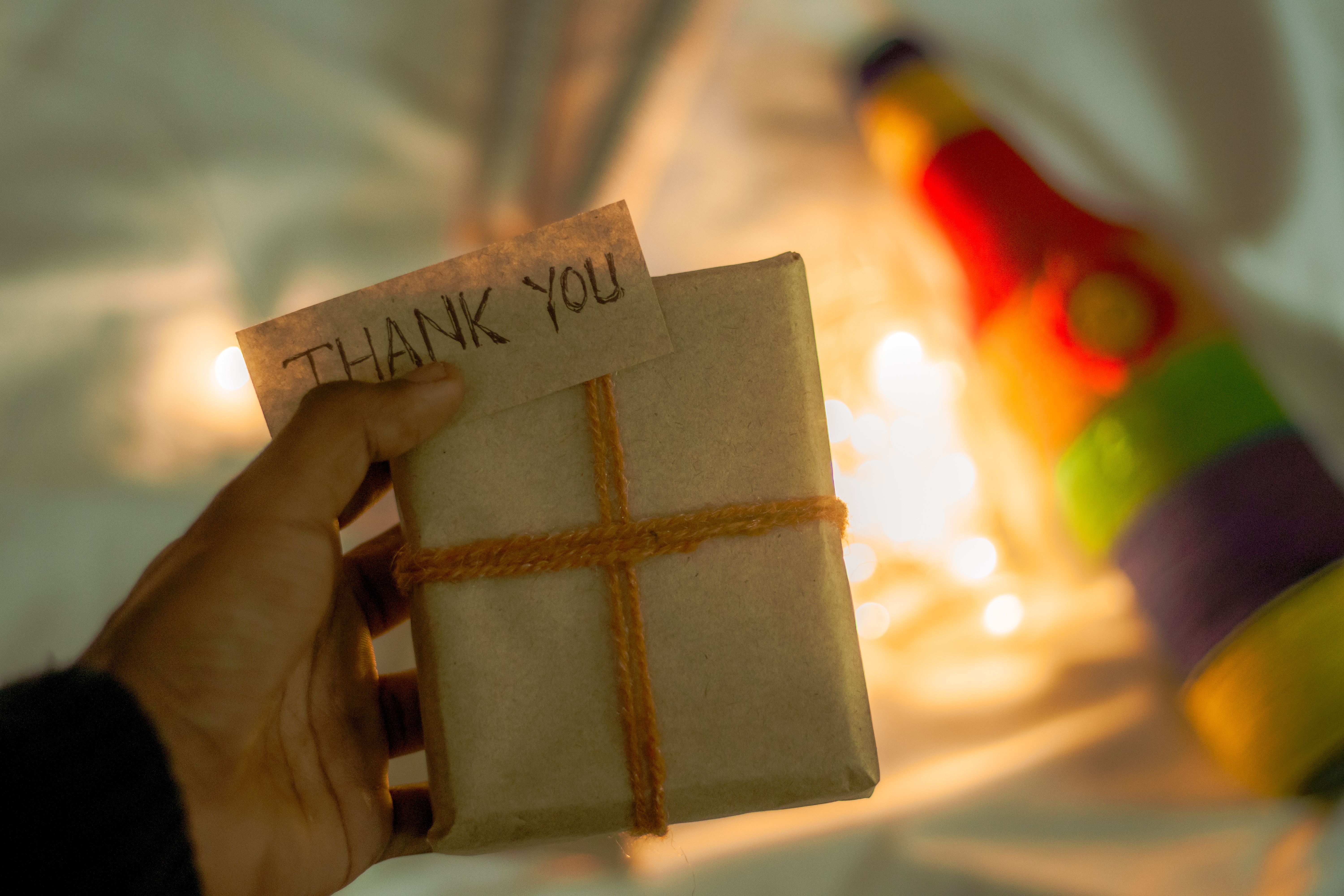 Wrapped thank-you gift with a handwritten appreciation note